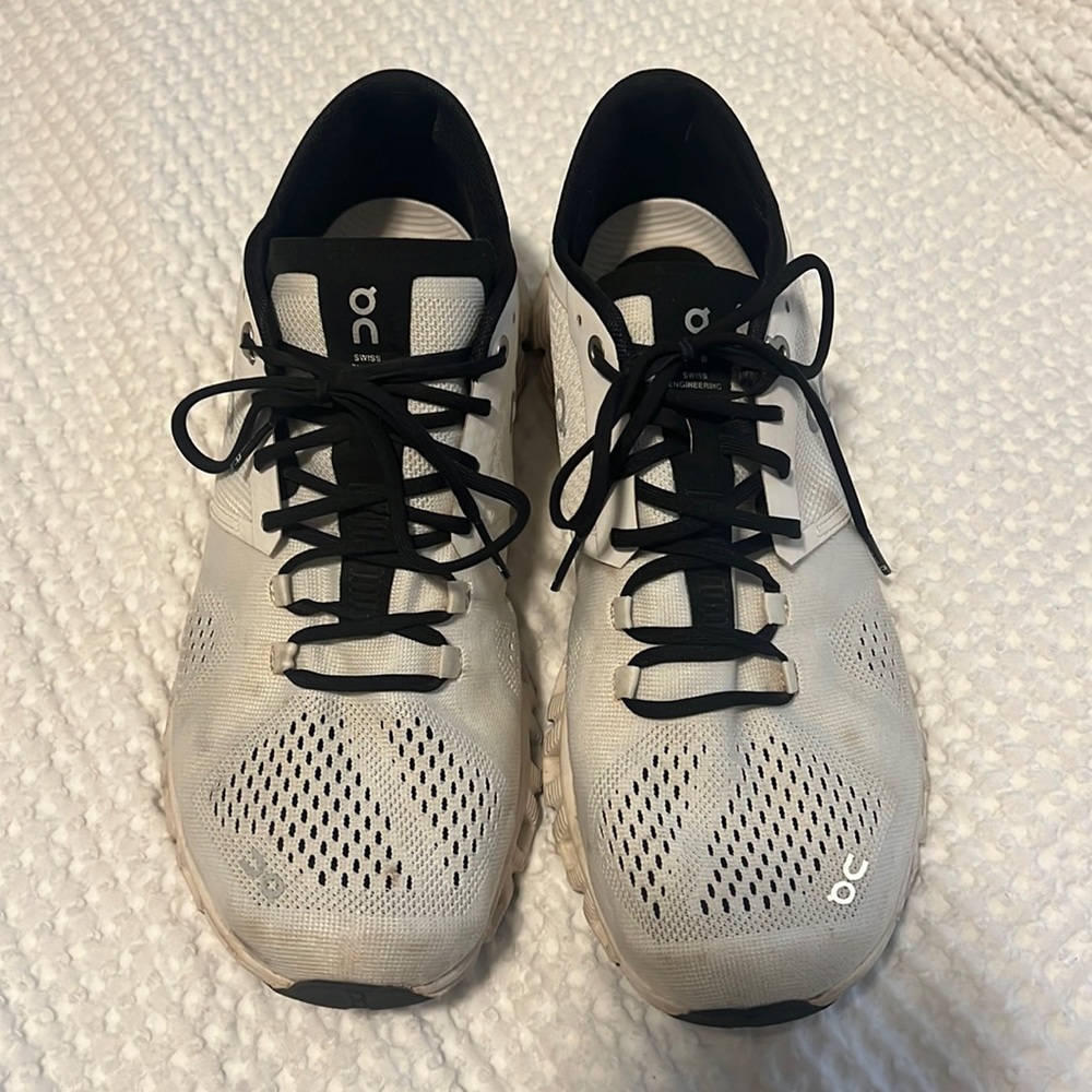 On Running White and Black Athletic Shoes
